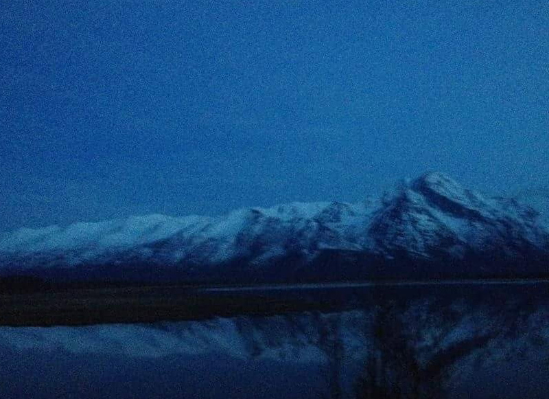 View of mountain past lake in Alaska